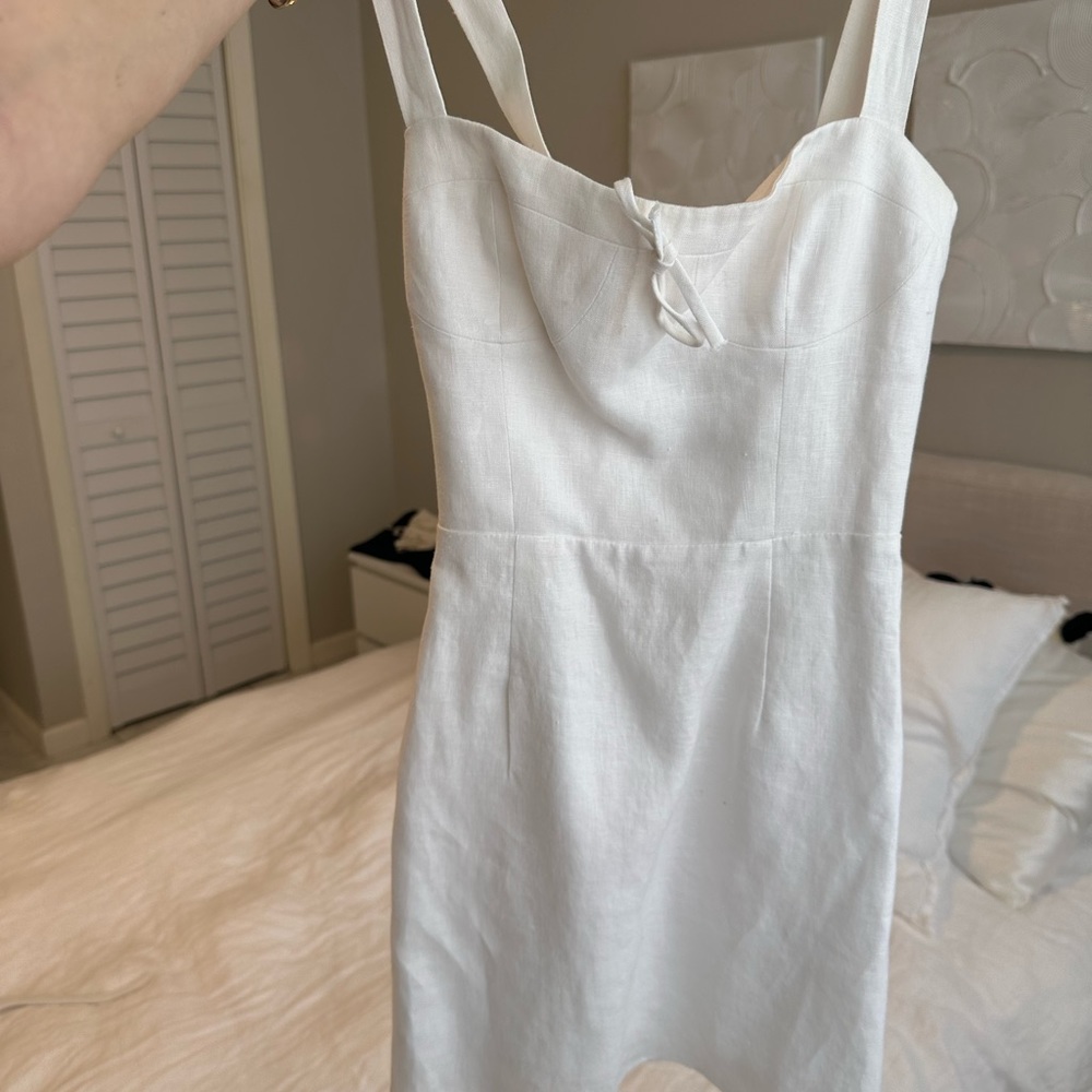 Reformation white linen mini dress with adjustable straps. Size 0